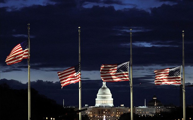 With the US Capitol in the distance, flags fly at half-staff at the Washington Monument on the National Mall following the death of former President Jimmy Carter, in Washington, DC, on December 30.
Mandatory Credit:	Kevin Lamarque/Reuters via CNN Newsource