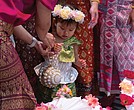 One-year-old dancer Anya Tangtrakul poses for a picture with other performers at the 26th Annual Asian American Festival at the Richmond Convention Center on May 4.