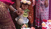 One-year-old dancer Anya Tangtrakul poses for a picture with other performers at the 26th Annual Asian American Festival at the Richmond Convention Center on May 4.