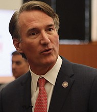 Gov. Glenn Youngkin speaking with reporters on April 8, 2024.