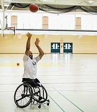 Paralympic gold medalist Trevon “Trey” Jenifer serves as a guest coach at Sportable’s Wheelchair Basketball Camp at Randolph Macon College’s Brock Sports & Recreation Center in August.
