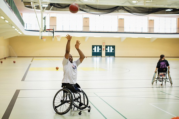 Paralympic gold medalist Trevon “Trey” Jenifer serves as a guest coach at Sportable’s Wheelchair Basketball Camp at Randolph Macon College’s Brock Sports & Recreation Center in August.