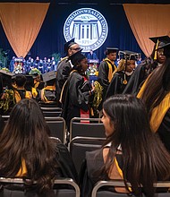 More than 100 Virginia Commonwealth University graduates walk out as Gov. Glenn Youngkin delivers his commencement address at the Greater Richmond Convention Center.