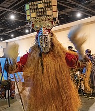 Elegba Folklore Society dancers enter the Capital City Kwanzaa celebration.