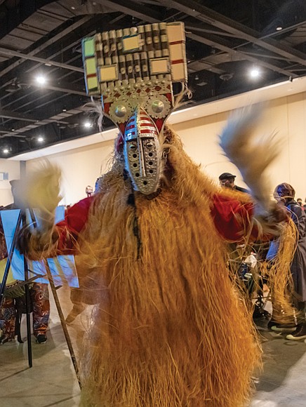 Elegba Folklore Society dancers enter the Capital City Kwanzaa celebration.