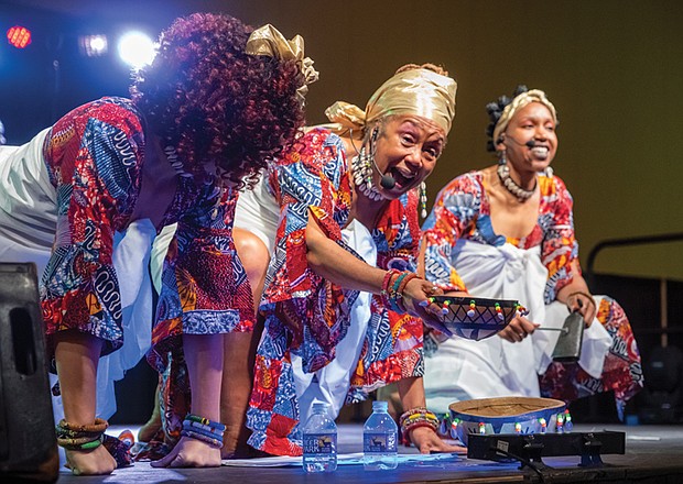 Janine Bell, founder and artistic director of Elegba Folklore Society, on Dec. 28 pours libation and performs during the 58th Capital City Kwanzaa celebration. The theme for the event was “Knowledge of Self.”