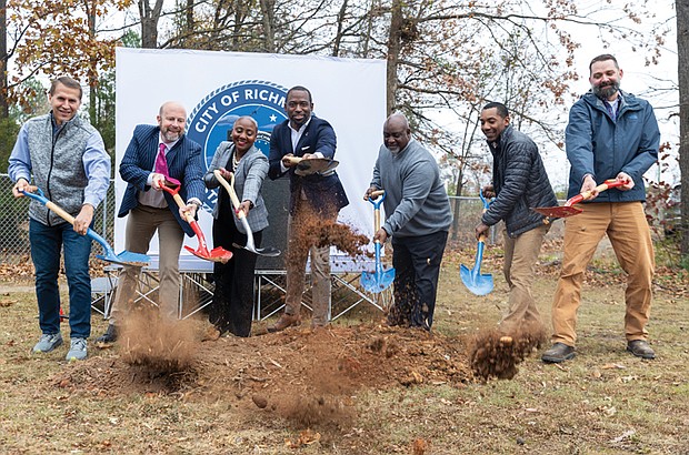 The James River Branch Trail took a big step forward with a groundbreaking ceremony Dec. 10 at Westover Hills Boulevard and Crutchfield Street. Pictured (from left): Jon Lugbill, executive director of Sports Backers; Chris Frelke, director of parks and recreation; Traci J. Deshazor, deputy chief administrative officer for human services; former Mayor Levar Stoney; Bobby Vincent Jr., director of public works; Andrew Alli, trails and greenways superintendent; and Ryan Rinn, capital projects planner. The 2-mile, multi-use trail will connect Westover Hills Boulevard to Hopkins Road, offering a safe route for biking and walking and enhancing access to South Side neighborhoods. Construction begins in the spring, with completion expected by December 2026.