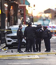 Emergency services attend the scene on Bourbon Street after a vehicle drove into a crowd on New Orleans' Canal and Bourbon Street on January 1.
Mandatory Credit:	Gerald Herbert/AP via CNN Newsource
