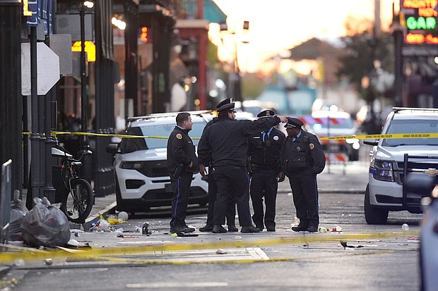 Emergency services attend the scene on Bourbon Street after a vehicle drove into a crowd on New Orleans' Canal and Bourbon Street on January 1.
Mandatory Credit:	Gerald Herbert/AP via CNN Newsource