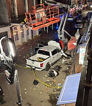 The suspect's pickup truck crashed near the Royal Sonesta New Orleans hotel, photos show. CNN has blurred parts of the image.
Mandatory Credit:	Paul S. via CNN Newsource