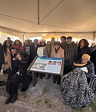 Family, friends and community members gather around the newly dedicated Heritage marker honoring the “Dixie Three” — Mildred Smith, Patricia Taylor and Agnes Stokes — at the former site of Dixie Hospital in Hampton on Saturday. The three Black nurses made history in 1963 by challenging segregation at the hospital, leading to a landmark civil rights victory.