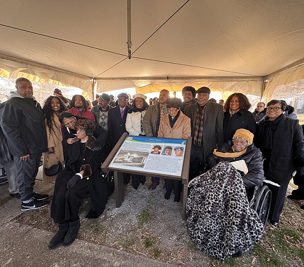 Family, friends and community members gather around the newly dedicated Heritage marker honoring the “Dixie Three” — Mildred Smith, Patricia Taylor and Agnes Stokes — at the former site of Dixie Hospital in Hampton on Saturday. The three Black nurses made history in 1963 by challenging segregation at the hospital, leading to a landmark civil rights victory.