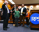 Ali Faruk, was sworn in as a new Richmond City School Board member representing the 3rd district at City Hall on Wednesday, January 8, 2025. With him is his wife Samieh and his two sons Yusef and Zayn. Faruk is a new school board member along with 4 other new members and 4 returning board members. (Julianne Tripp HIllian/ Richmond Free Press)