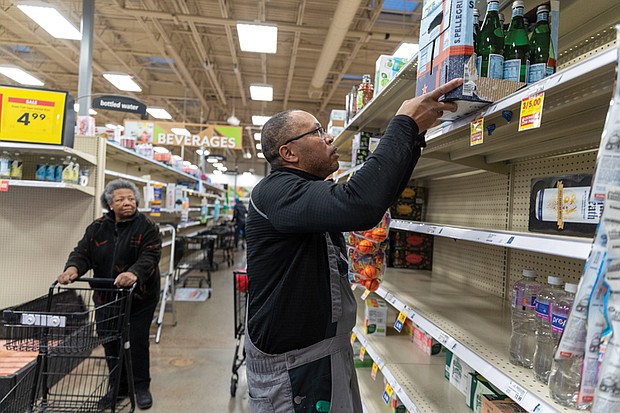 Van Tatum, an employee at Kroger in Carytown, stocks shelves with sparkling water, the only bottled water remaining after the water bottle aisle was cleared out by customers within two hours of Richmond issuing a boil water advisory Monday, Jan. 7. The advisory followed a winter storm-related outage that caused a failure at a City of Richmond water treatment facility.