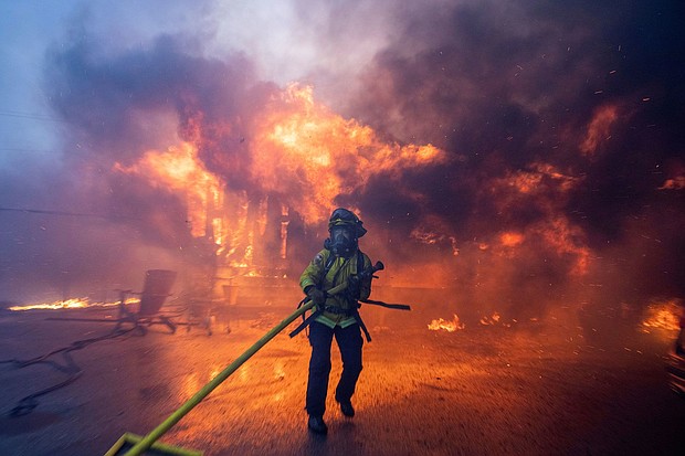 A firefighter battles the Palisades Fire as it burns during a windstorm on the west side of Los Angeles, California, U.S. January 7.
Mandatory Credit:	Ringo Chiu/Reuters via CNN Newsource