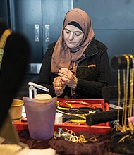 Leanne Merritt handcrafts jewelry, shaping wire into words of her customers’ choosing.