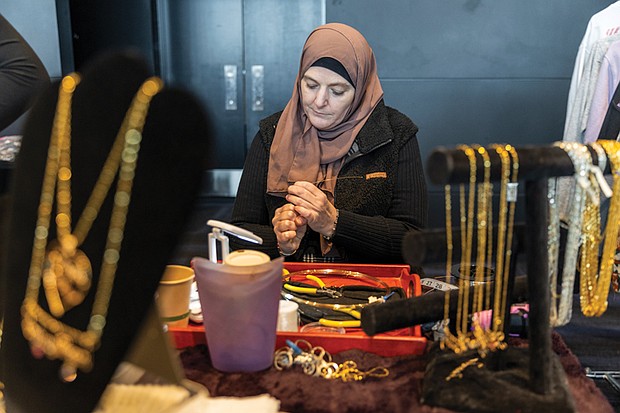 Leanne Merritt handcrafts jewelry, shaping wire into words of her customers’ choosing.