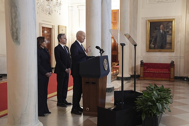 President Joe Biden, right, with Vice President Kamala Harris, left, and Secretary of State Antony Blinken, center, speaks in the Cross Hall of the White House on the announcement of a ceasefire deal in Gaza.
Mandatory Credit:	Evan Vucci/AP via CNN Newsource