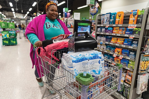 Andrea Eaddy was one of the last customers to grab cases of water last week after Richmond issued a boil water advisory.