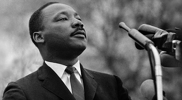 Dr. Martin Luther King Jr. speaks before a crowd of 25,000 civil rights marchers outside the state capitol building on March 25, 1965, in Montgomery, Alabama. Stephen F. Somerstein/Getty Images
