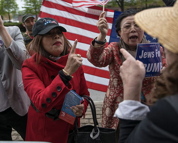 Supporters of then-President Donald Trump, left and center, argue with anti-Trump protesters on May 4, 2017, in New York City. Robert Nickelsberg/Getty Images