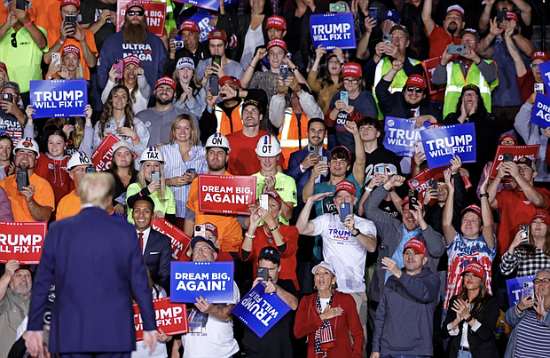 Republican presidential candidate Donald Trump greets supporters during a campaign rally in Grand Rapids, Michigan, on November 5, 2024 -- the day American voters chose to return him to the White House. Kamil Krzaczynski/AFP via Getty Images