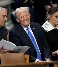 Former President Barack Obama talks with President-elect Donald Trump at the state funeral for former President Jimmy Carter at the Washington National Cathedral on January 9. Ben Curtis/AP