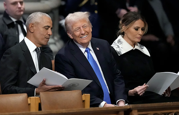 Former President Barack Obama talks with President-elect Donald Trump at the state funeral for former President Jimmy Carter at the Washington National Cathedral on January 9. Ben Curtis/AP