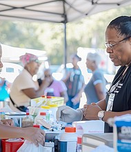 Attendees community health receive free health screenings and wellness advice at fair