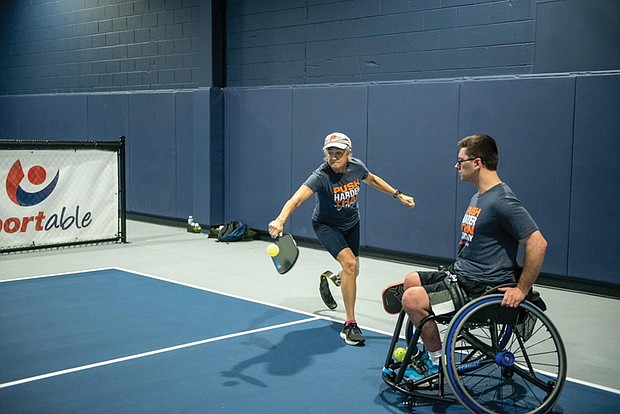 Suellen Henneberry plays pickle ball, showcasing her commitment to adaptive sports
and her inspiring journey after a leg amputation.