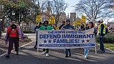 Protesters march in Monroe Park on Dr. Martin Luther King Jr. Day, carrying banners and chanting in solidarity with immigrant families during the “We Fight Back” protest, held in response to President Trump’s second inauguration and part of a nationwide call to action.