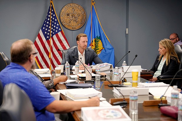 Oklahoma State Superintendent of Public Instruction Ryan Walters, center, has praised the proposed rule change that would require families to report their immigration status to schools.
Mandatory Credit:	Bryan Terry/The Oklahoman/ USA Today Network/Imagn Images via CNN Newsource