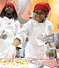 Kyla Stallings (right) and Israel Mays (left) participants in the Virginia Randolph Culinary Arts program, plate tasty bites during the Career and Technical Education Career Rodeo Skills Challenge on Jan. 23 at the Richmond Raceway Complex.