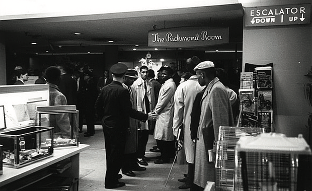 Richmond police attempt to move Virginia Union University students out of a restaurant in Thalhimers department store downtown where they refused to leave, protesting the white-only policy for service.