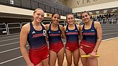 The University of Richmond’s 4x400 relay team — Elke Van der Westhuizen, Nina Lavelle, Molly Flanaga and Morgan Elliot — poses on the track after winning first place at the VMI Invitational.