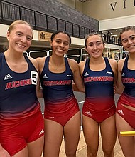 The University of Richmond’s 4x400 relay team — Elke Van der Westhuizen, Nina Lavelle, Molly Flanaga and Morgan Elliot — poses on the track after winning first place at the VMI Invitational.