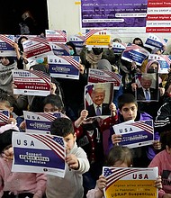 Afghan refugees hold placards during a meeting to discuss their situation after President Donald Trump paused U.S. refugee programs, in Islamabad, Pakistan, Friday, Jan. 24. When the U.S. pulled out of Afghanistan in August 2021, it carried tens of thousands of Afghans to safety. But years later, many others are still waiting to be resettled.