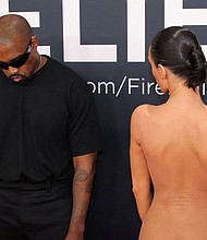 Ye's casual black T-shirt and trousers stood in stark contrast to Censori's nudity.
Mandatory Credit:	Daniel Dole/Reuters via CNN Newsource