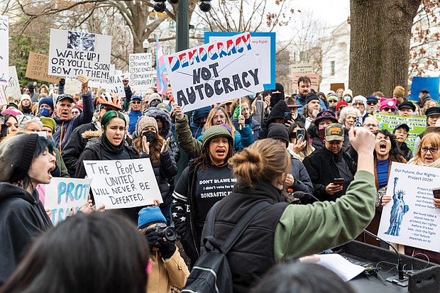 Hundreds of protestors on Capitol Square listen as Lyn Jones, 16, speaks to the crowd at the Bell Tower on Wednesday, Feb. 5. Jones helped organize the demonstration as part of the nationwide “50 Protests, 50 States, 1 Day” movement, protesting the policies of President Donald Trump’s administration.