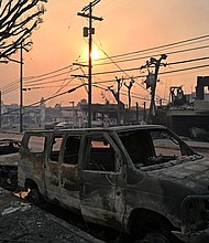 Charred vehicles are seen along a road after the passage of the Palisades Fire in Pacific Palisades, California last month.  Allstate insurance said paying claims from the fire will cost it an estimated $1.1 billion.
Mandatory Credit:	Agustin Paullier/AFP/Getty Images via CNN Newsource