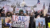 Demonstrators and lawmakers rally against President Donald Trump and his ally Elon Musk as they disrupt the federal government, including dismantling the U.S. Agency for International Development, which administers foreign aid approved by Congress, on Capitol Hill in Washington, Wednesday, Feb. 5, 2025.