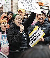 Christina Collazo, with the RVA Women’s March group, speaks to a crowd of hundreds of protestors as part of the nationwide “50 Protests, 50 States, 1 Day” event at the Bell Tower in Capitol Square on Wednesday, Feb. 5.