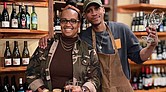 Penny’s Wine Shop owners Kristen Gardner Beal and Lance Lemon stand among their carefully curated selection of natural wines in their Brook Road shop. Their online wine membership program, RichWine, is featured in a Google ad airing during the Super Bowl in the Richmond market.