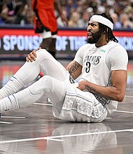 Anthony Davis fell to the ground after he tried to defend a drive by Alperen Şengün.
Mandatory Credit:	Jerome Miron/USA TODAY Sports/Reuters via CNN Newsource