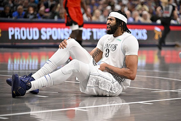 Anthony Davis fell to the ground after he tried to defend a drive by Alperen Şengün.
Mandatory Credit:	Jerome Miron/USA TODAY Sports/Reuters via CNN Newsource
