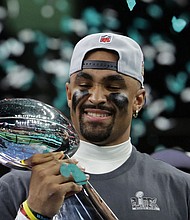 Philadelphia Eagles QB Jalen Hurts celebrates with the Vince Lombardi Trophy after winning the Super Bowl.
Mandatory Credit:	Mike Segar/Reuters via CNN Newsource