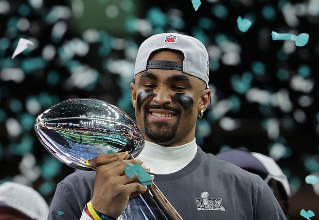 Philadelphia Eagles QB Jalen Hurts celebrates with the Vince Lombardi Trophy after winning the Super Bowl.
Mandatory Credit:	Mike Segar/Reuters via CNN Newsource