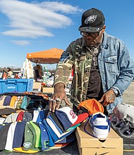 Nathan Nelson browses a selection of caps Feb. 1 at the Azalea Flea Market. Below, this Azalea Flea Market is shown one week before the long-running local tradition closed for good.