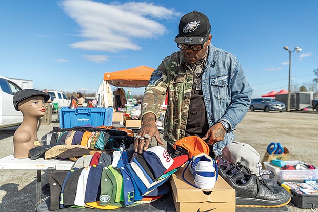 Nathan Nelson browses a selection of caps Feb. 1 at the Azalea Flea Market. Below, this Azalea Flea Market is shown one week before the long-running local tradition closed for good.