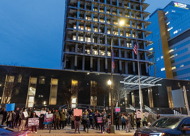 Dozens of demonstrators gather on Broad Street outside Richmond City Hall on Feb. 5, chanting “Trans rights now” in support of continued access to transgender health care for minors amid recent policies enacted by President Trump’s administration.